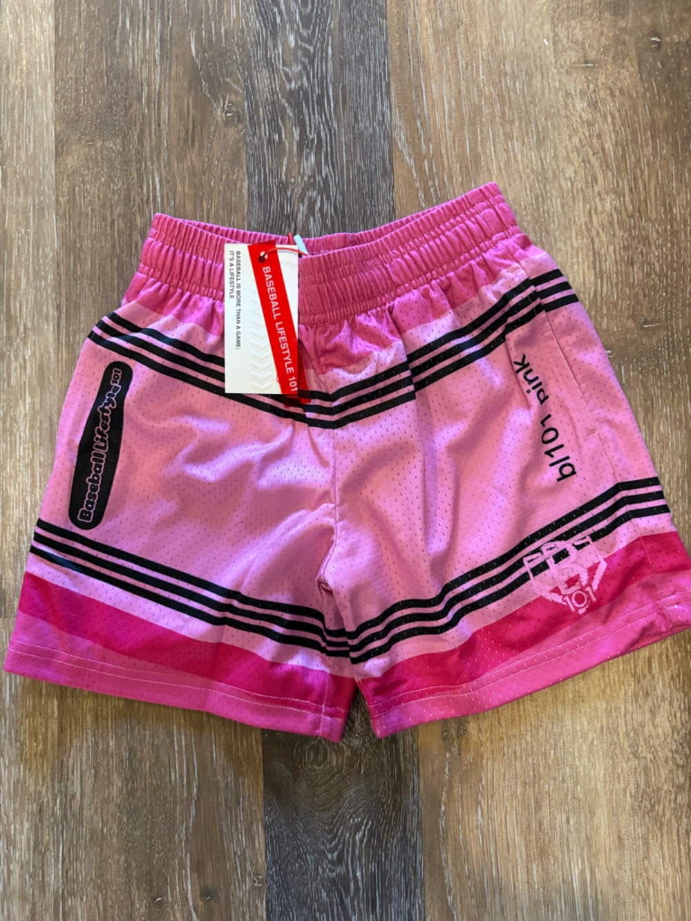 Pink Athletic Kids Shorts with Black Stripe Accents